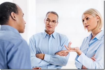 Three businesspeople talking. 