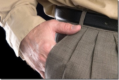 Man with hand in suit pocket