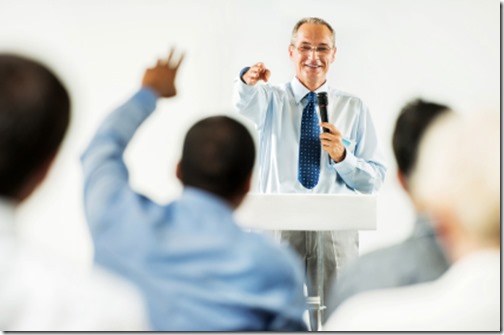 Mature adult man having a public speech. 