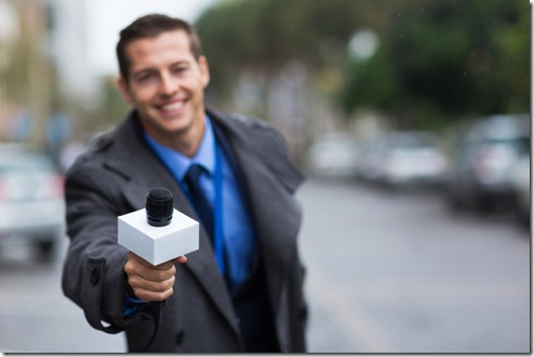 young journalist giving microphone