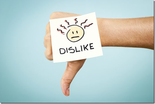 Dislike concept with hand on blue background