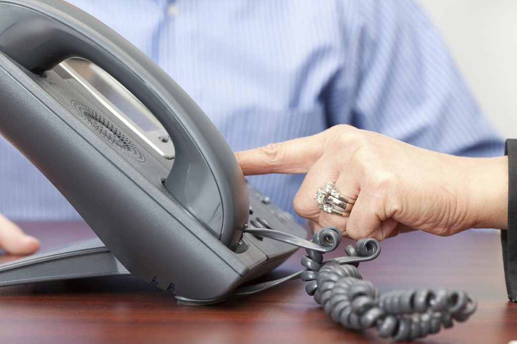 Two-People-Dialing-Telephone-iStockPhoto-PPT.jpg