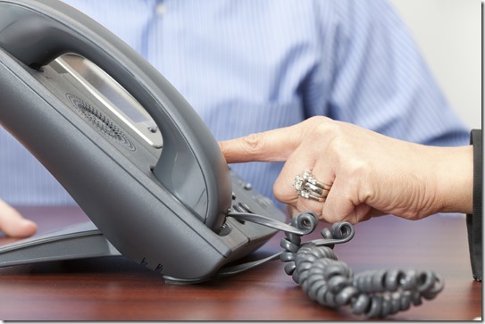 Two People Dialing Telephone iStockPhoto PPT