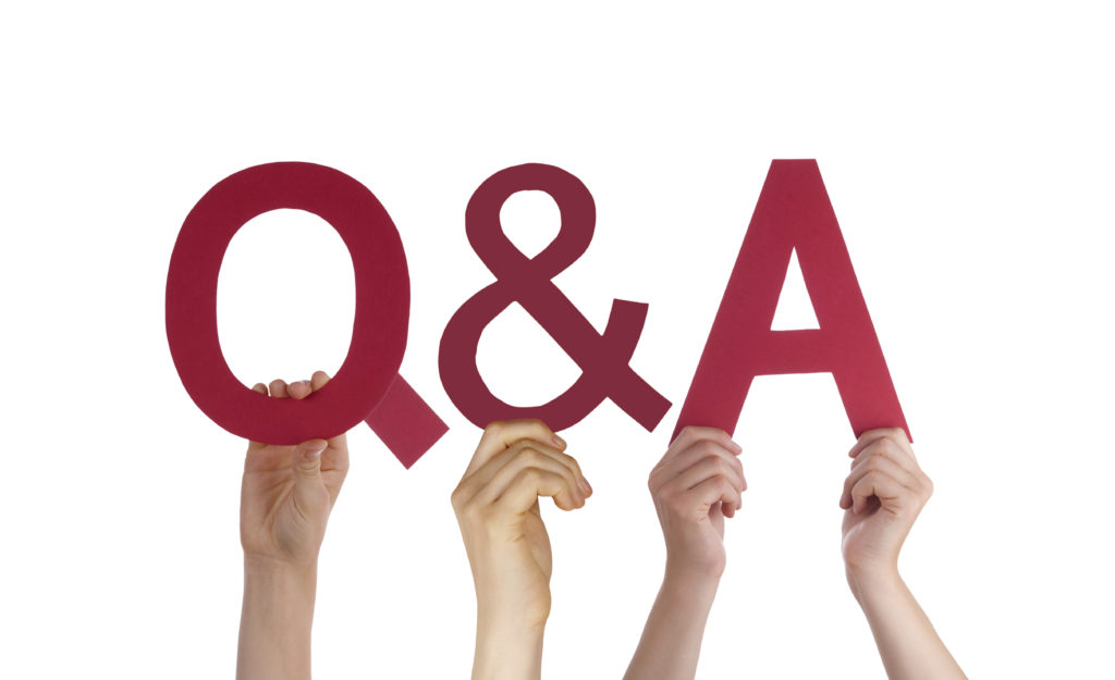 Many Caucasian People And Hands Holding Red Straight Letters. Or Characters Building The Isolated English Word Q And A Means Questions And Answers On White Background