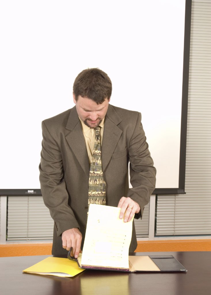 Speaker Looking At Papers iStockPhoto