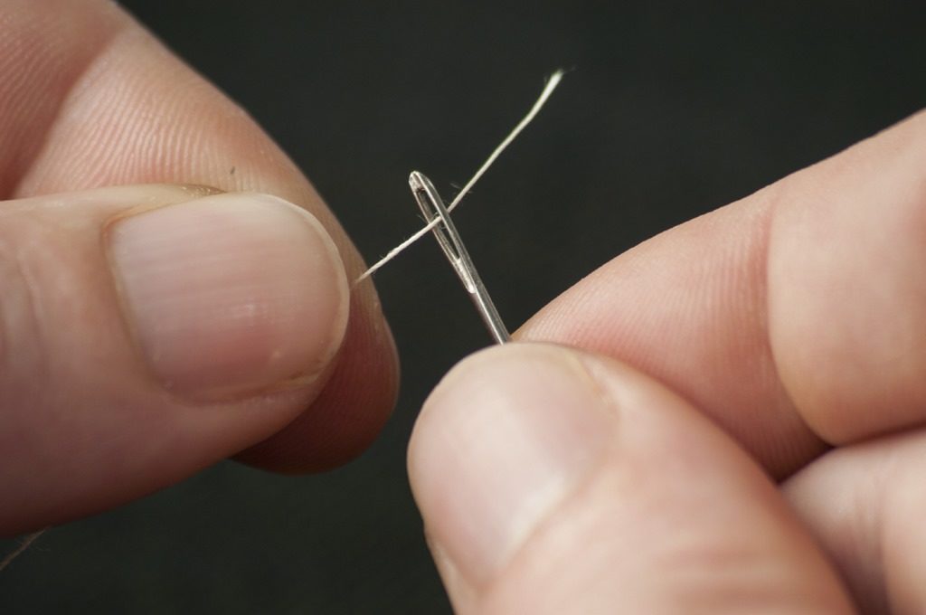 A needle being thread