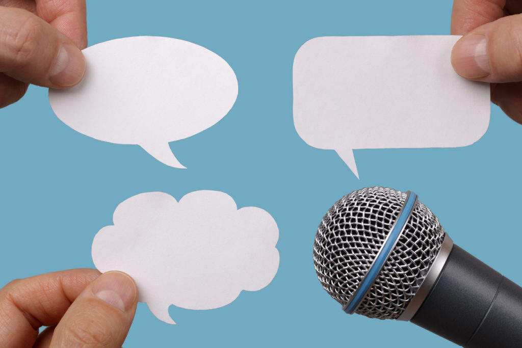 Blank speech bubbles with microphone