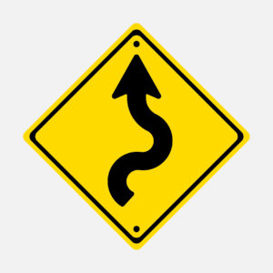 Yellow directional sign for staying on track
