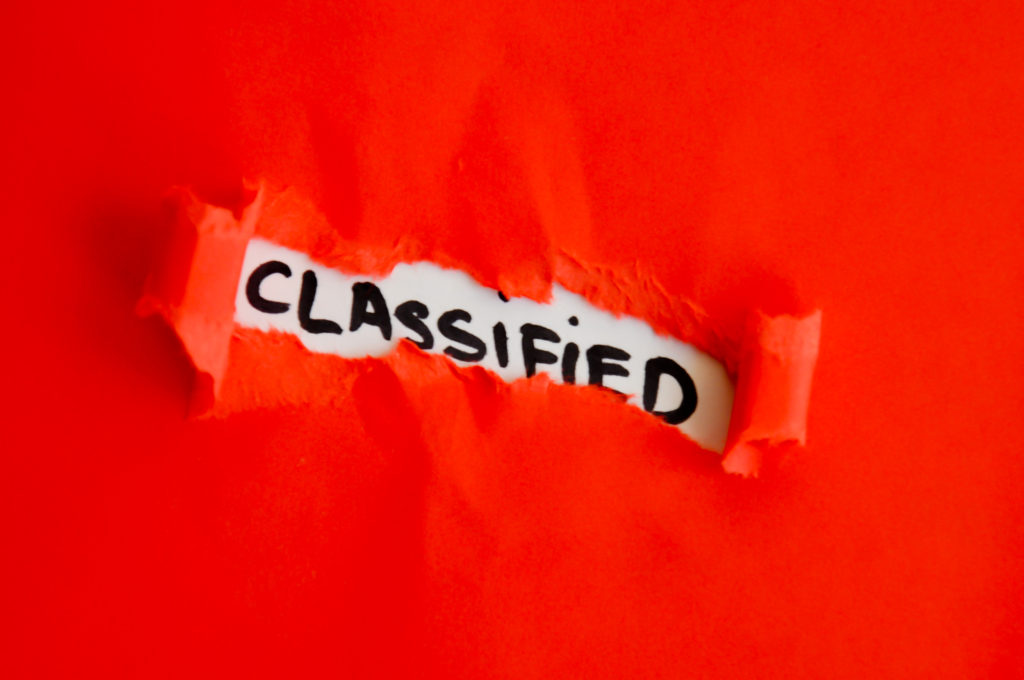 Orange background with "Classified" written in center