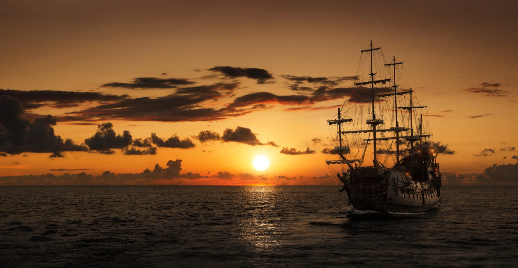 Silhouette of a pirate ship at the open sea