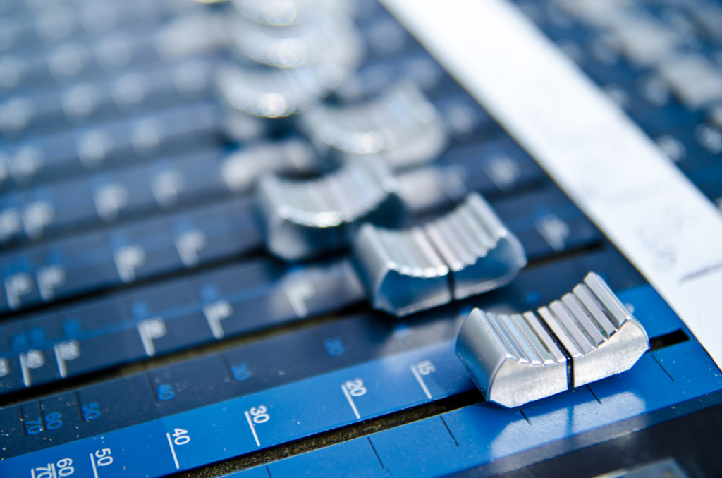 A music mixer control panel closeup