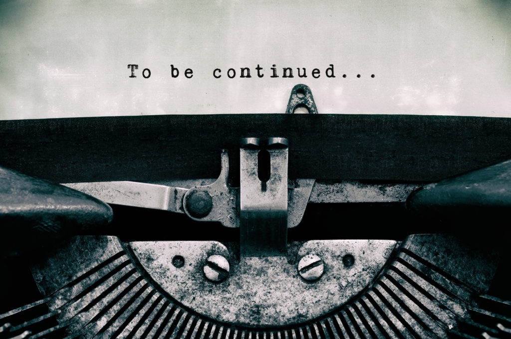 "To be continued" written on paper of black-and-white old typewriter
