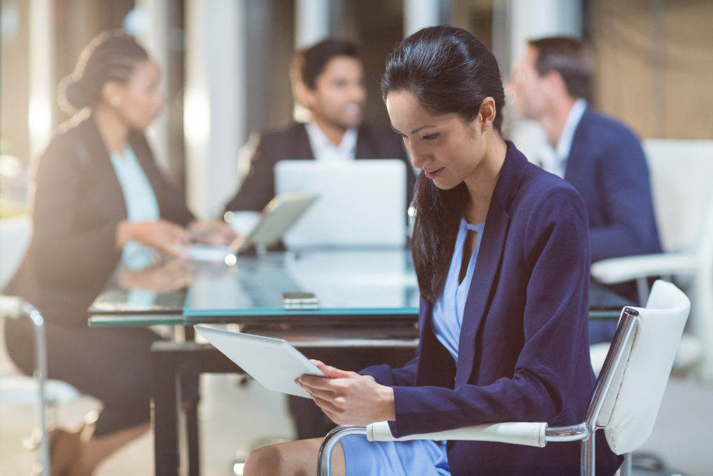 Businesswoman using digital tablet in the office