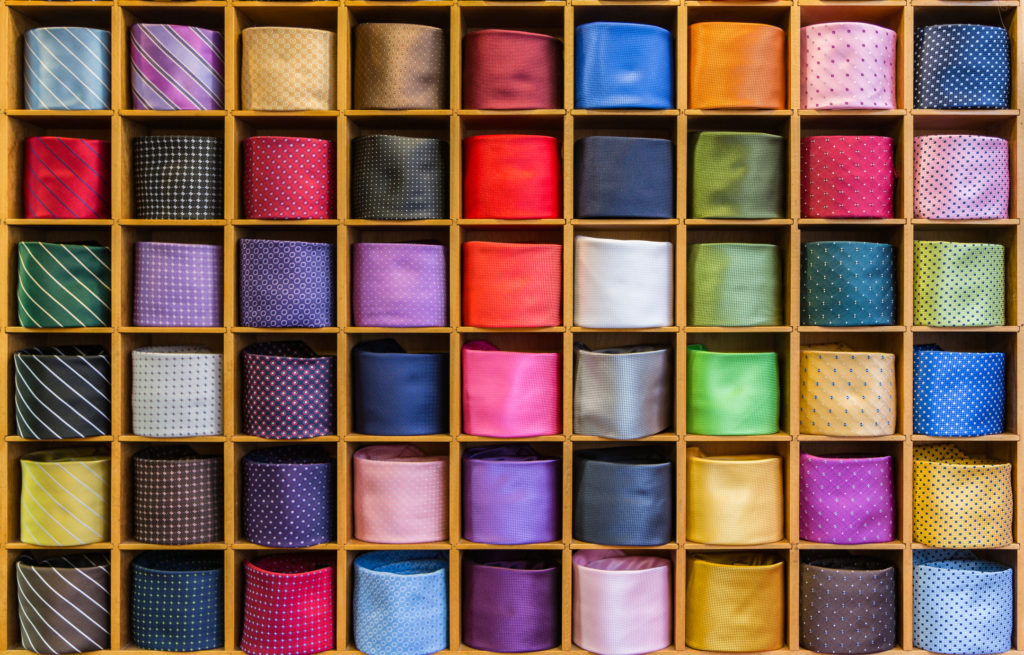 uses of body language in presentation View of different colors ties in the showcase