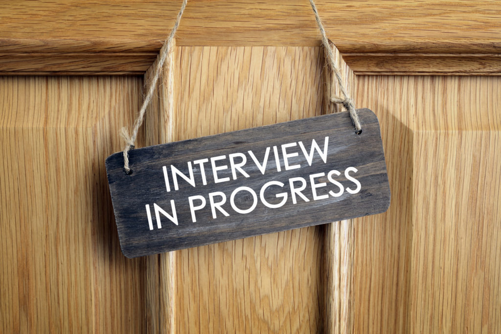 Interview in progress sign on office