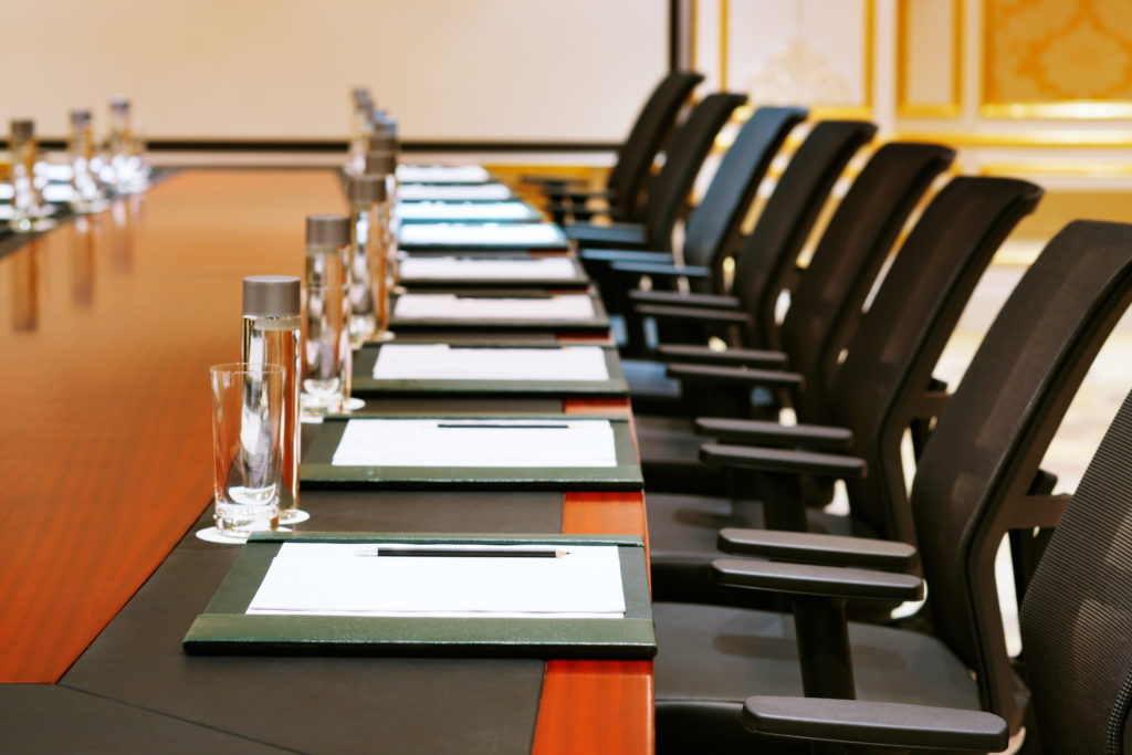 empty seats at a boardroom table