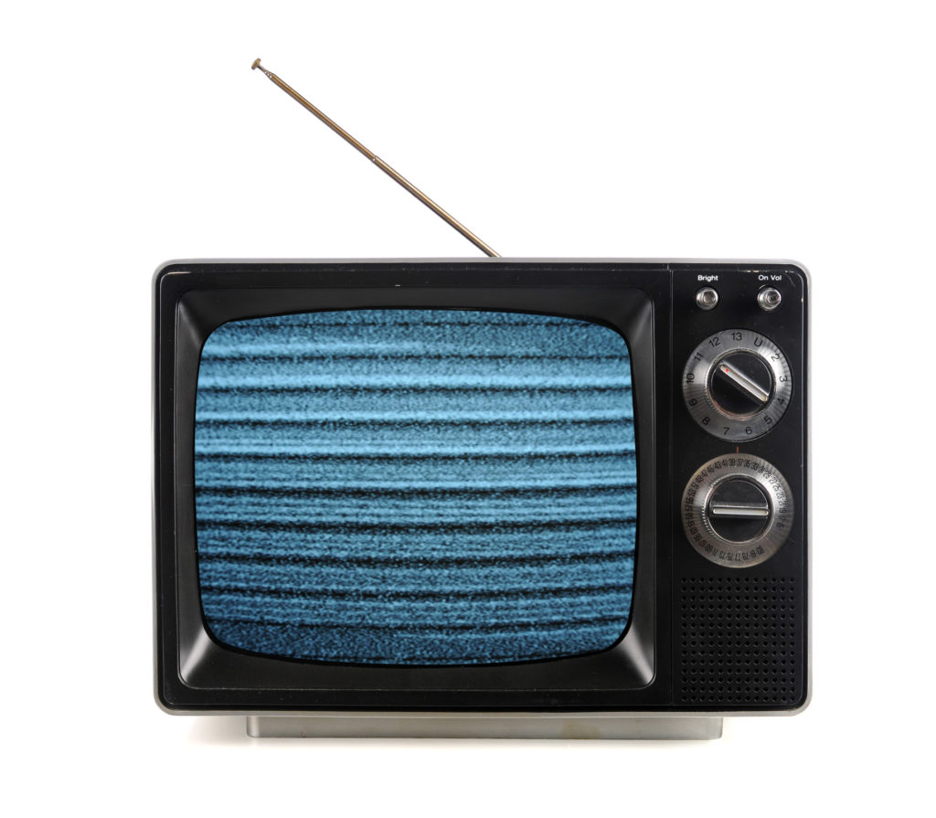 Vintage television with snow bands and patterns isolate over white